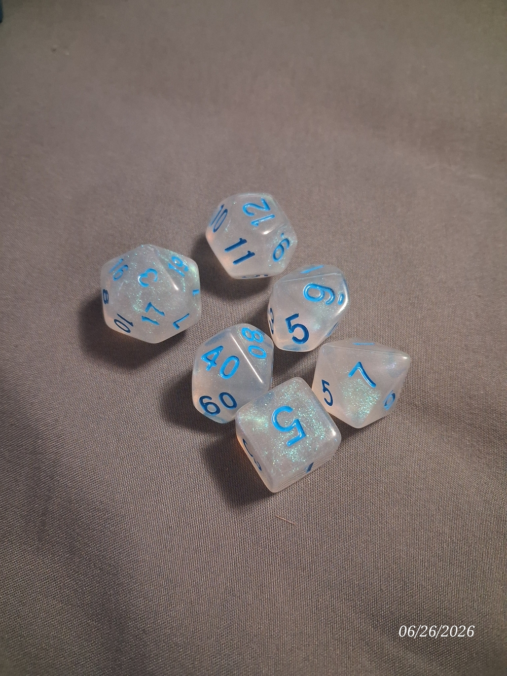 Source Unknown Sparkling White RPG Dice Set with Blue Numbers